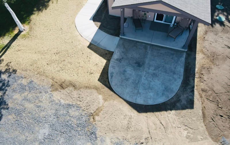 Aerial view of a new concrete patio behind a home