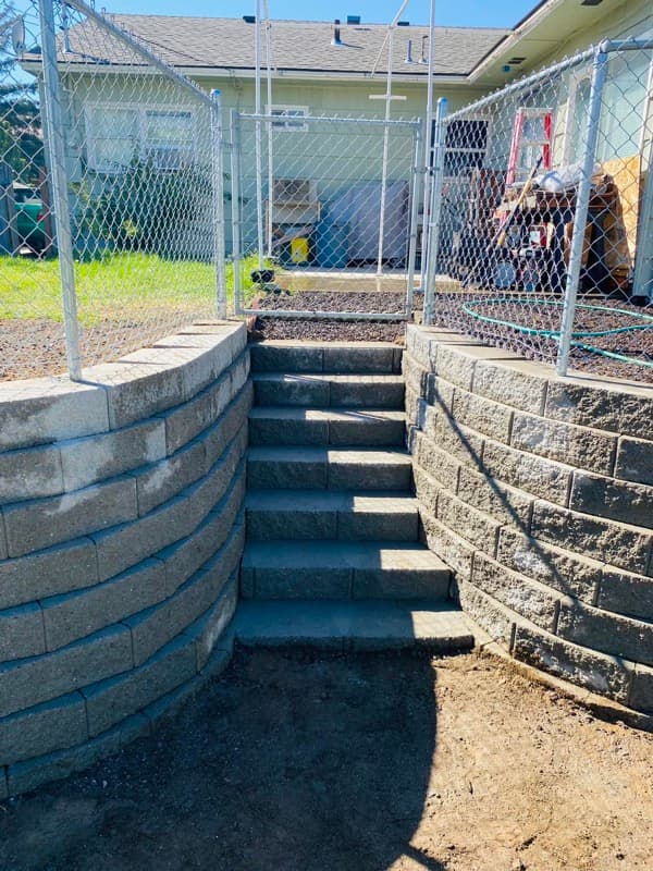 Block retaining walls with stairs between them